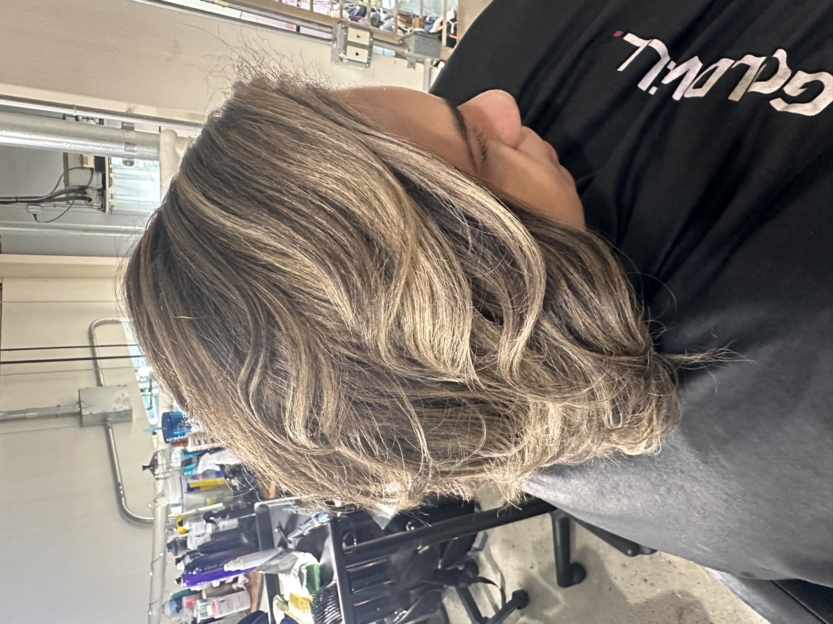 Curled burgundy style by Hair by Isis